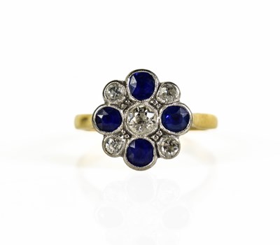 Lot 5 - An antique gold floral cluster ring featuring...