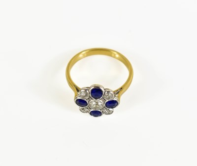 Lot 5 - An antique gold floral cluster ring featuring...