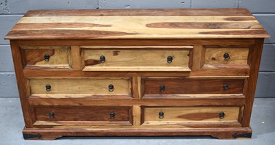 Lot 472 - An Indian hardwood chest of three over four...