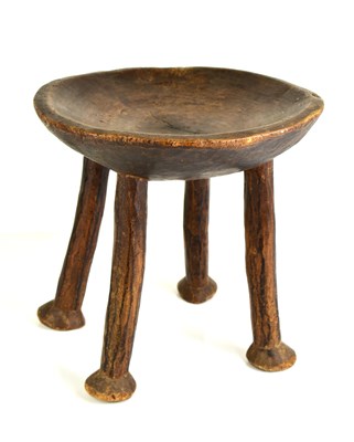 Lot 160 - An antique African style dish raised on four...