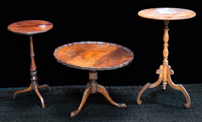 Lot 480 - A group of tripod tables to include a 19th...