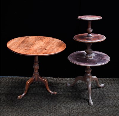 Lot 500 - A Georgian mahogany three tier dumbwaiter,...