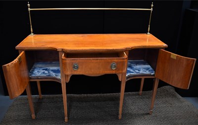 Lot 526 - An antique mahogany serpentine sideboard, with...