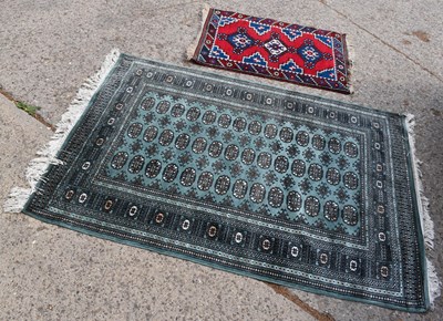 Lot 457 - A traditional Pakistani Bokhara wool rug,...