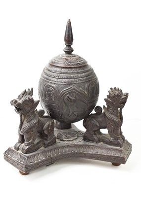 Lot 417 - A 19th century Burmese chinthe lion stand...