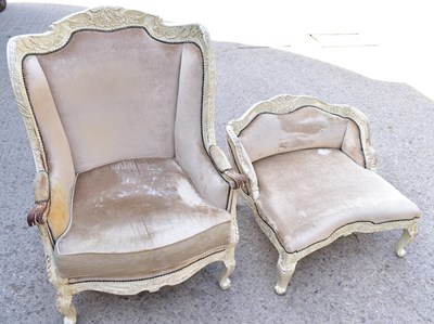 Lot 502 - A Louis XV-style carved and painted wingback...