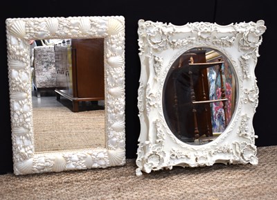 Lot 451 - A rectangular wall mirror decorated with white...