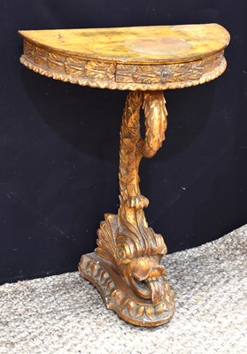 Lot 518 - An Italian giltwood and polychrome demi-lune...
