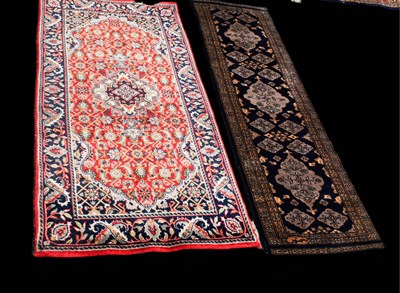 Lot 461 - A Persian style wool rug, red ground with a...