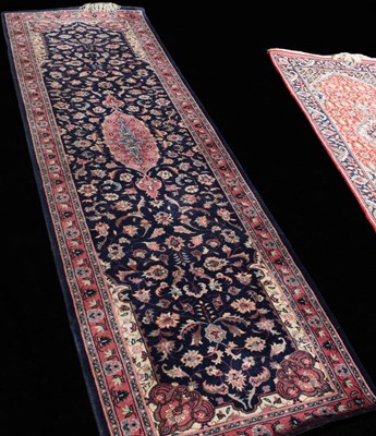 Lot 458 - A Persian style wool runner, blue ground with...