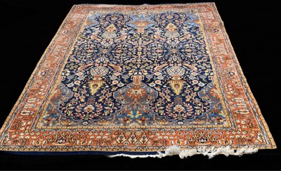 Lot 462 - A Persian style wool rug, blue ground with...