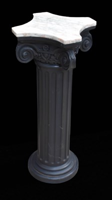 Lot 503 - An ebonised torchere stand on a fluted column...