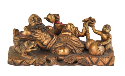 Lot 165 - A 20th century Chinese carving depicting man...