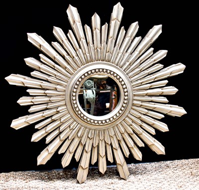 Lot 450 - A decorative starburst form wall mirror,...