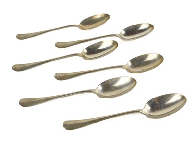 Lot 360 - A set of six silver dessert spoons, monogram...