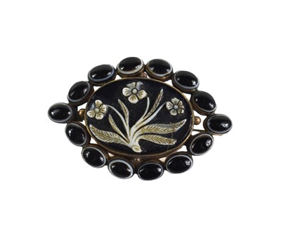 Lot 103 - A Victorian mourning brooch, the central oval...