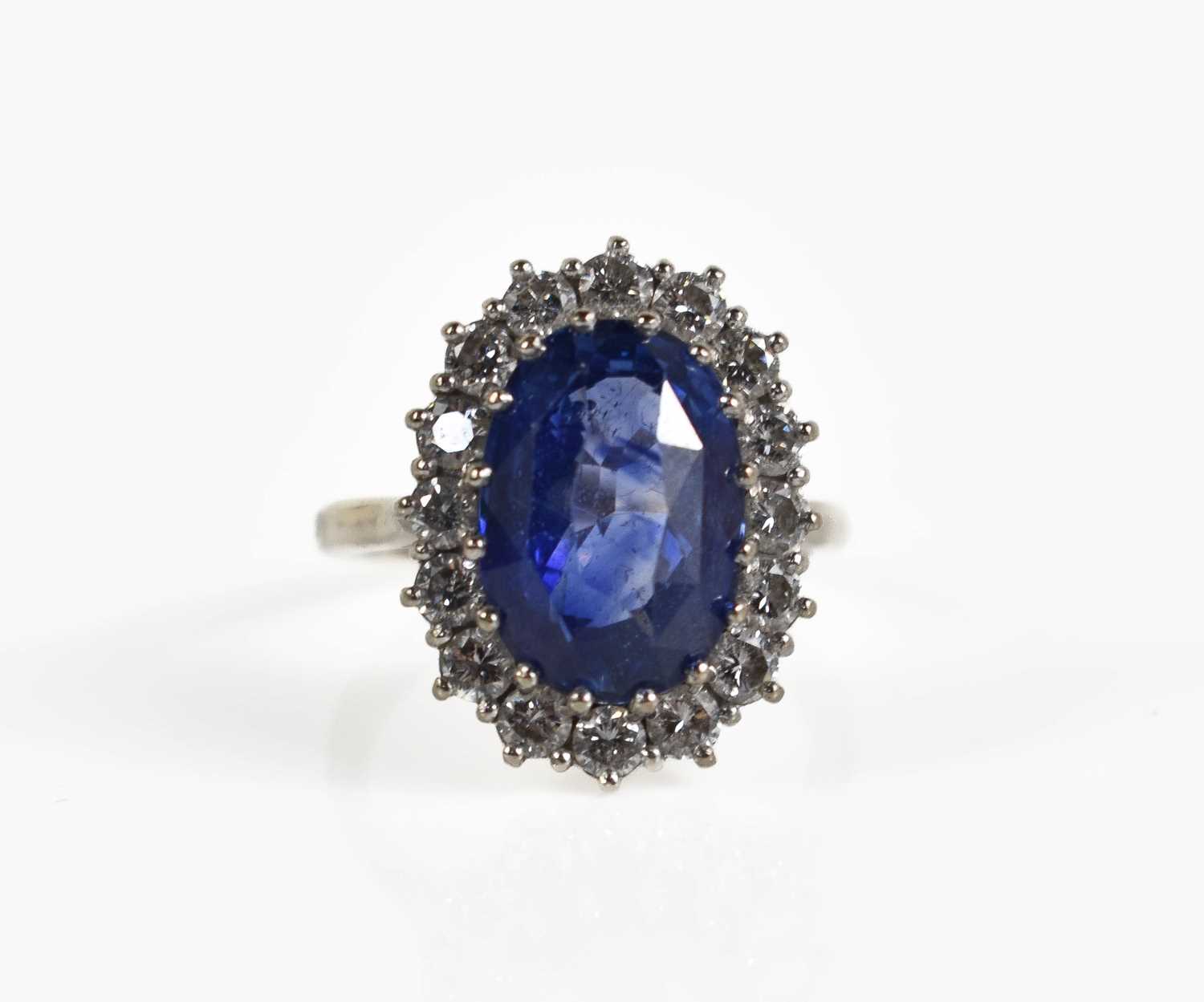 Lot 6 - An 18ct white gold, diamond and sapphire ring,...