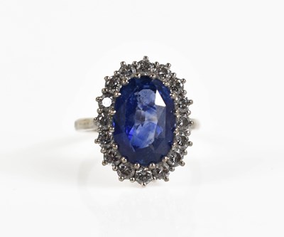 Lot 6 - An 18ct white gold, diamond and sapphire ring,...