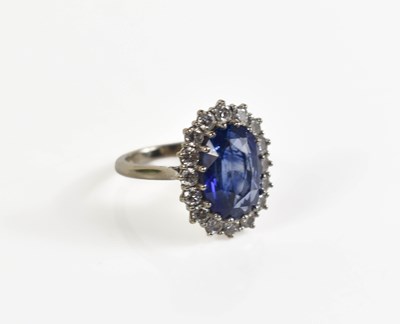 Lot 6 - An 18ct white gold, diamond and sapphire ring,...