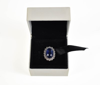 Lot 6 - An 18ct white gold, diamond and sapphire ring,...