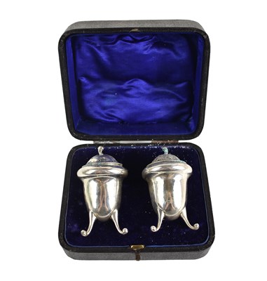 Lot 302 - A silver salt & pepper, with bud finials,...