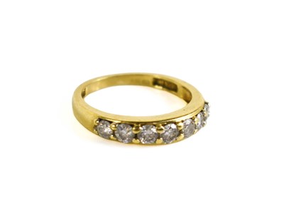 Lot 196 - An 18ct gold and diamond half hoop eternity...