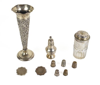 Lot 303 - A group of silver to include a one rupee India...
