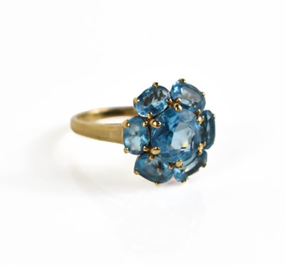 Lot 115 - A 9ct gold and blue topaz set ring in the form...