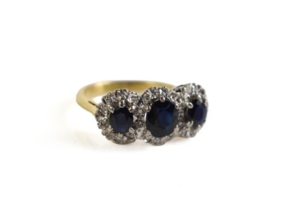 Lot 195 - An 18ct gold, sapphire and diamond ring, the...