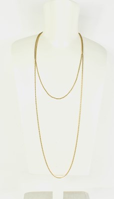 Lot 205 - An antique 9ct gold muff chain with swivel...