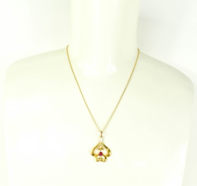 Lot 85 - An Art Nouveau 9ct gold pendant of foliate...