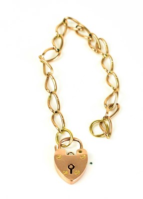 Lot 208 - A 9ct gold chain link bracelet with padlock...