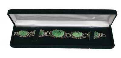 Lot 3 - A Chinese white metal and jade pearl bracelet,...