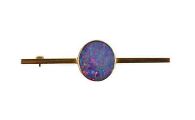 Lot 132 - A 9ct gold and opal tie pin / brooch, the...