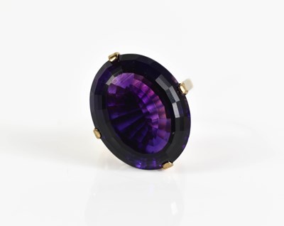 Lot 178 - A 9ct gold and amethyst dress ring, the oval...