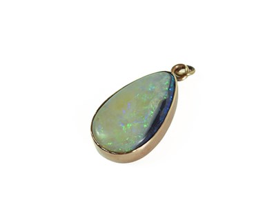 Lot 131 - A 15ct gold and opal pendant, the pear drop...