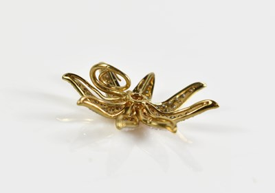 Lot 11 - An 18ct gold and diamond set pendant in the...