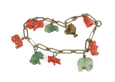 Lot 4 - A Chinese yellow metal, coral and jade...