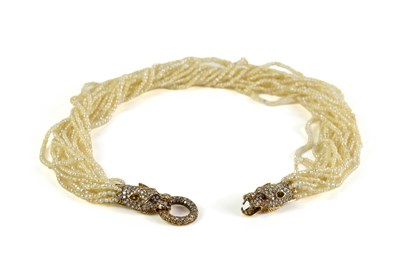 Lot 267 - An unusual gold, diamond, ruby and seed pearl...