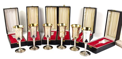 Lot 376 - A set of six silver wine goblets, with gilt...