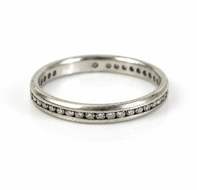 Lot 183 - A De Beers platinum and diamond full eternity...