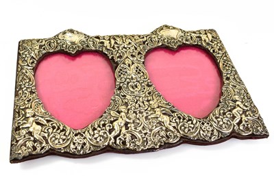 Lot 314 - An Edwardian silver twin heart shaped picture...