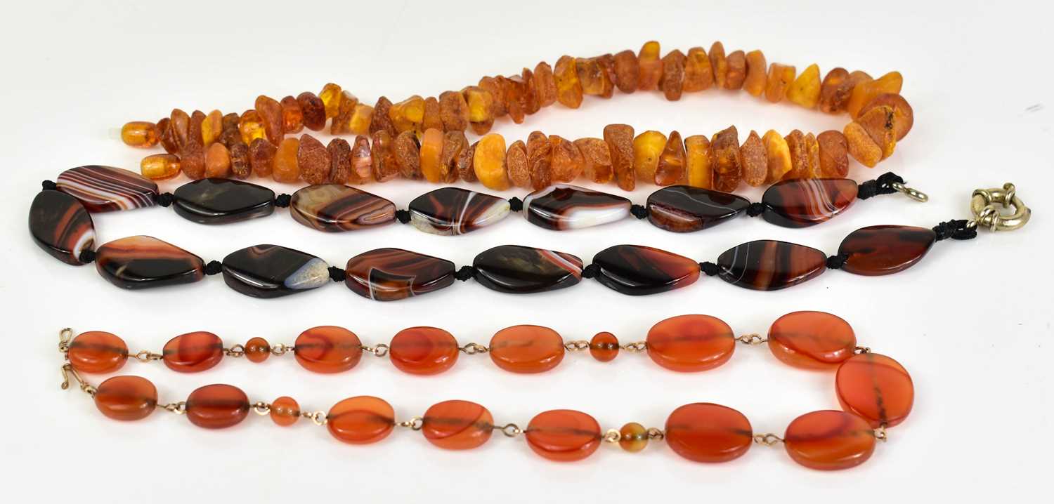 Lot 34 - Three vintage beaded necklaces: a rough cut...