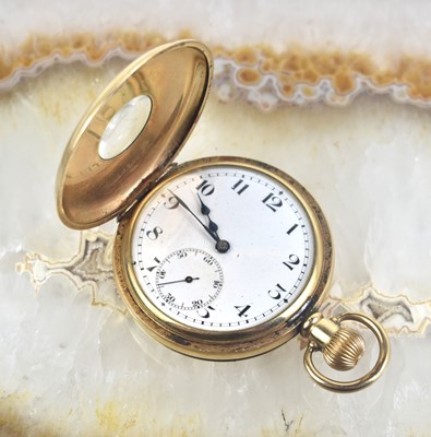 Lot 277 - A gold plated half-hunter pocket watch, white...