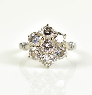 Lot 17 - An 18ct white gold and diamond flowerhead ring,...