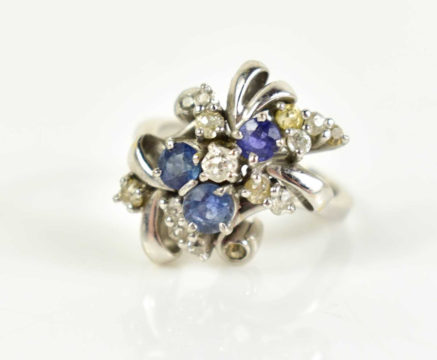 Lot 14 - A 14ct white gold, diamond and sapphire...