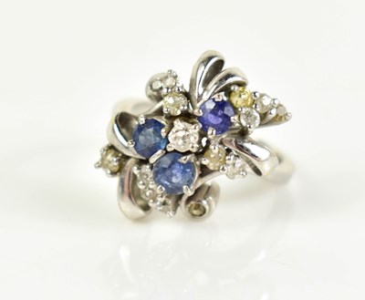 Lot 14 - A 14ct white gold, diamond and sapphire...