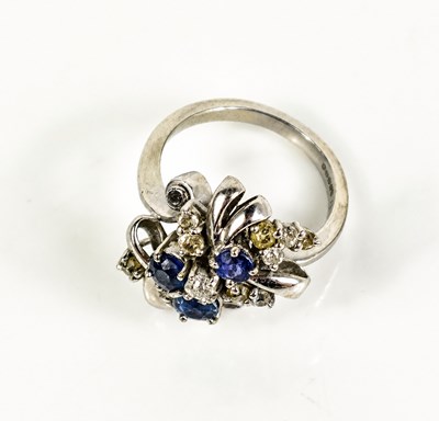 Lot 14 - A 14ct white gold, diamond and sapphire...
