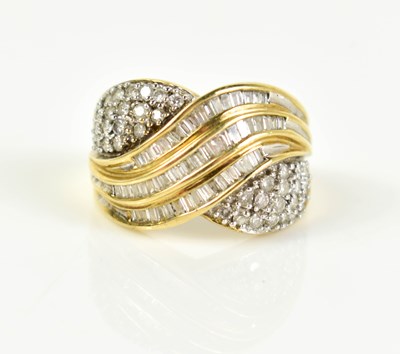 Lot 182 - A 9ct gold and diamond cluster cross over ring,...