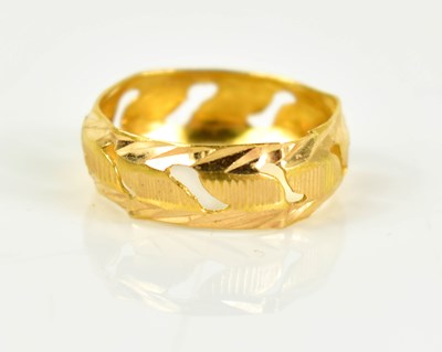 Lot 160 - A gold pierced and embossed wedding band, size...